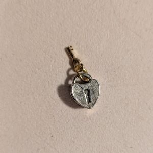Heart-Shaped Silver and Gold Lock Charm